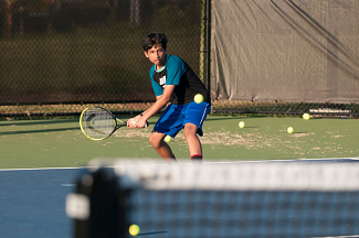 Boy playing tennis